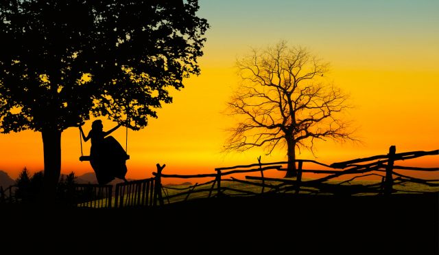 Photo Illustration of a Girl Watching the Sunset From a Tree Swing