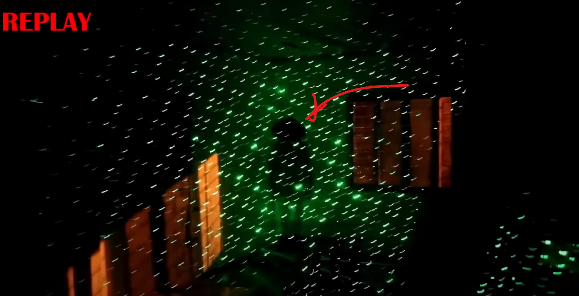While investigating with a sparkle laser light, it appears as if a shadowy figure is caught on camera stating across the room.