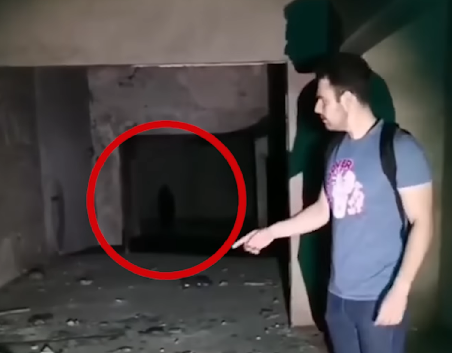 While exploring an abandon building, a shadowy figure is seen in the background.