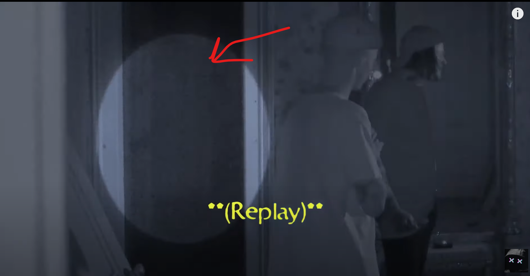 A faint mist or apparition is captured in the background behind the investigators.