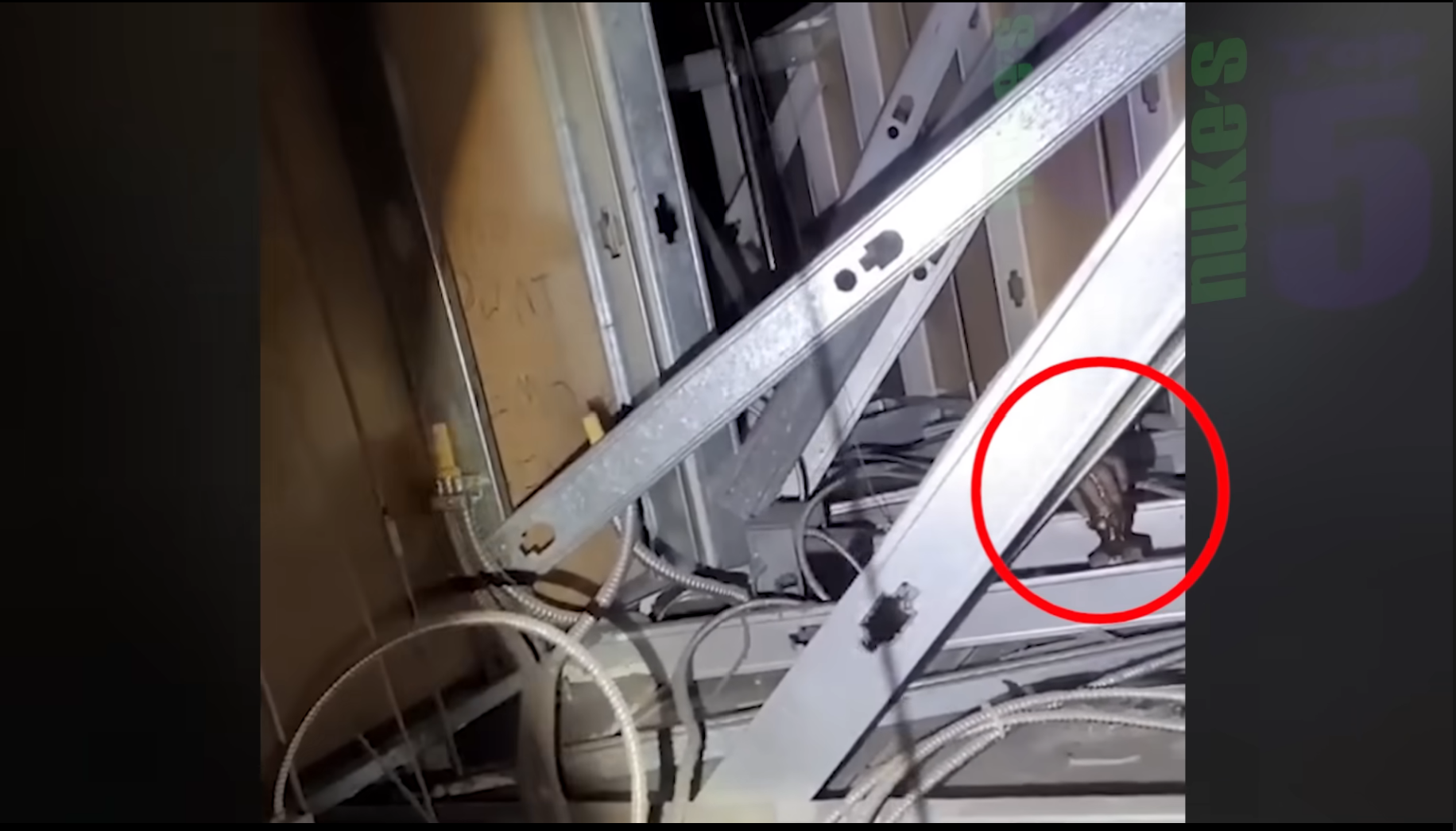 A creepy hand is seen in the attic when the security guard musters the courage to check out the noise.