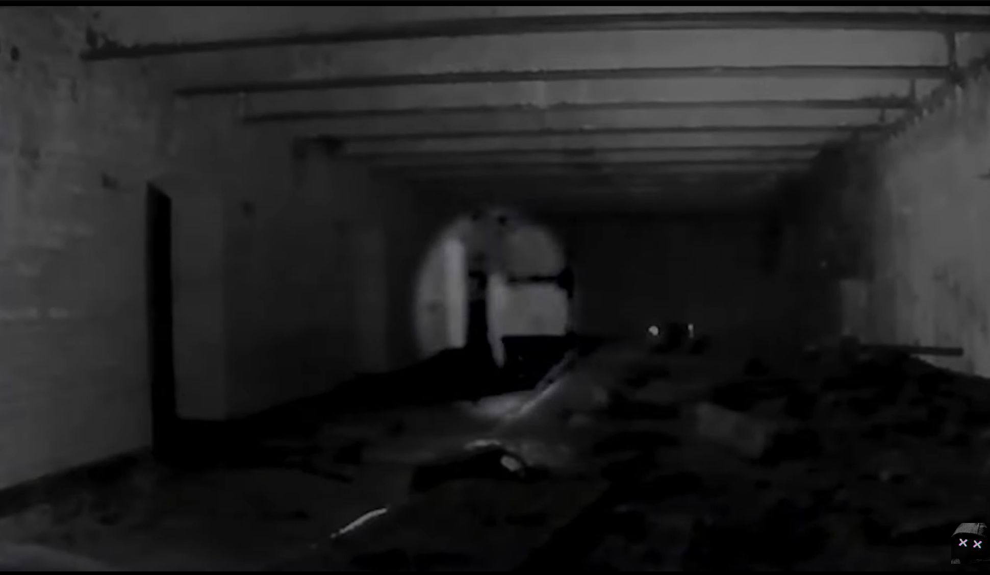 An apparition is caught on camera walking across the abandon building.
