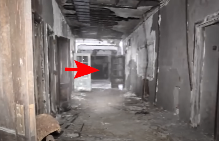 Shadowy figure seen across the hallway while exploring an abandon school