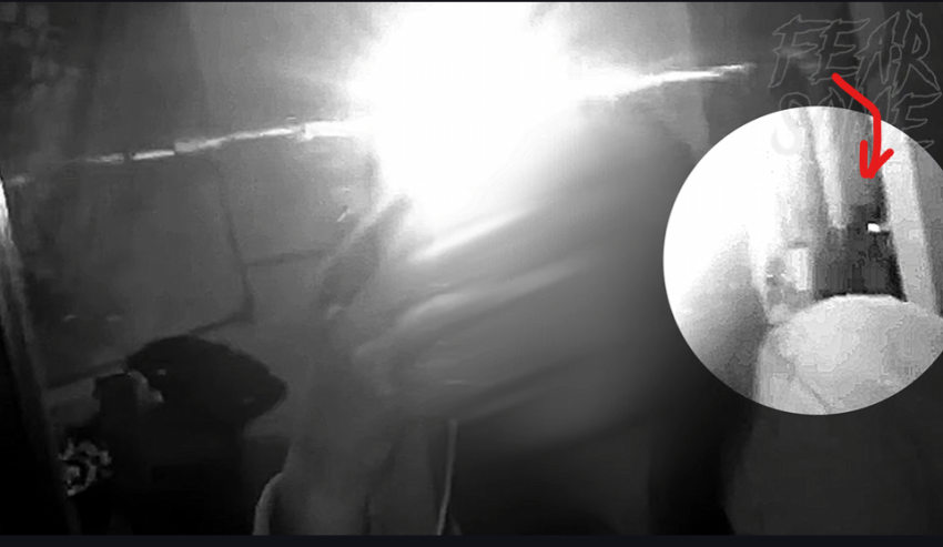 Small shadowy figure is caught on camera crossing the hallway.